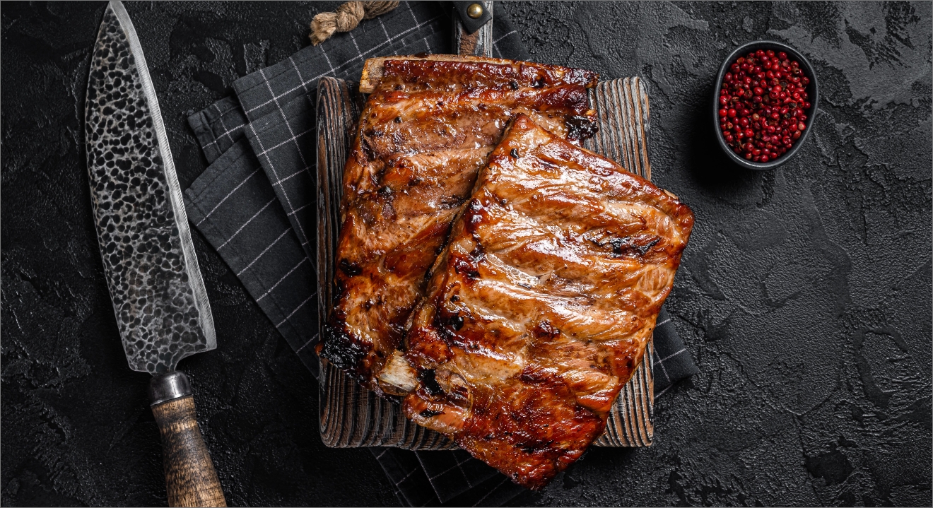 stack-grilled-pork-ribs-bbq-sauce-chopping-board-black-background-top-view